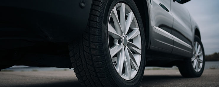 Selective focus on blask SUV car rear wheel